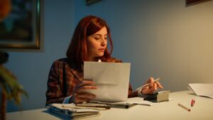 Girl writes down the bill costs